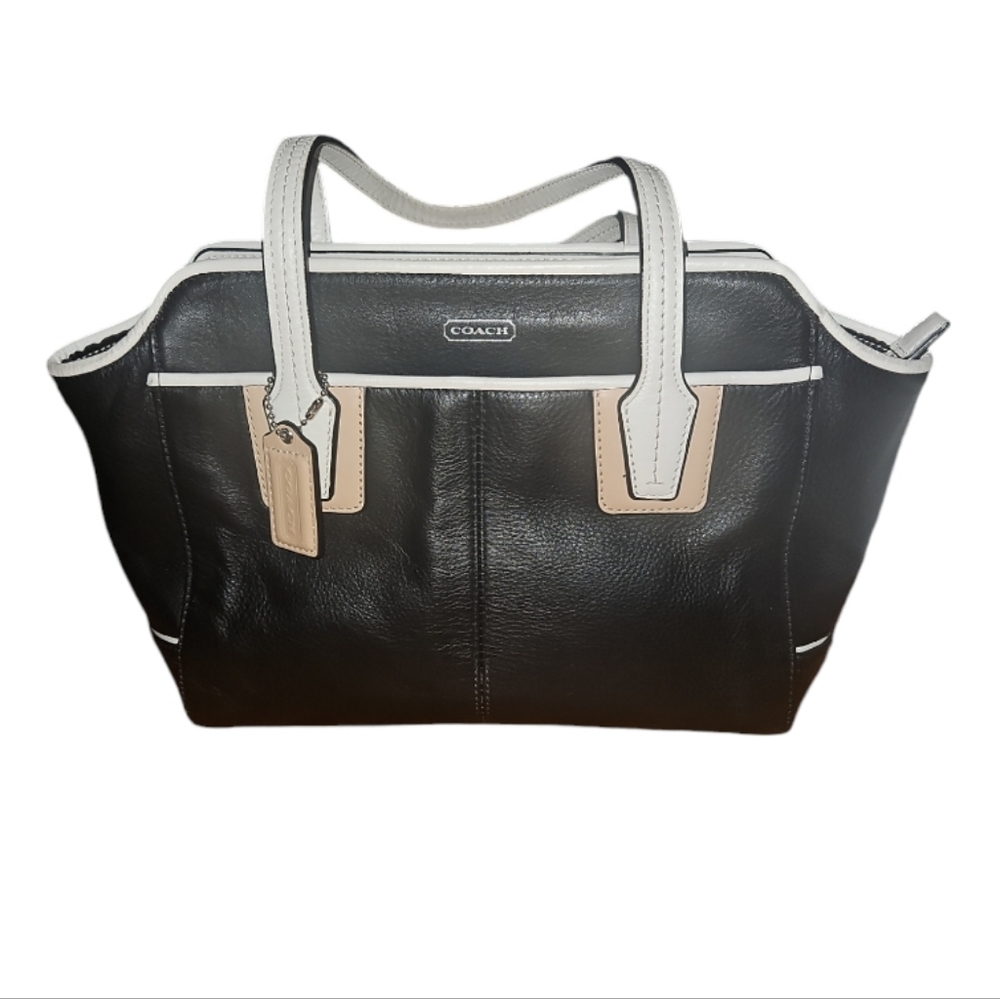 Coach handbag missing crossbody strap. Some peeling on handle. No wear on bottom